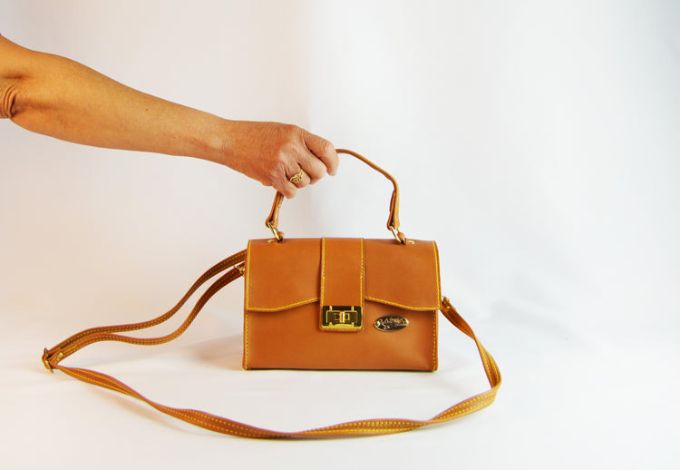 lady holding leather bag