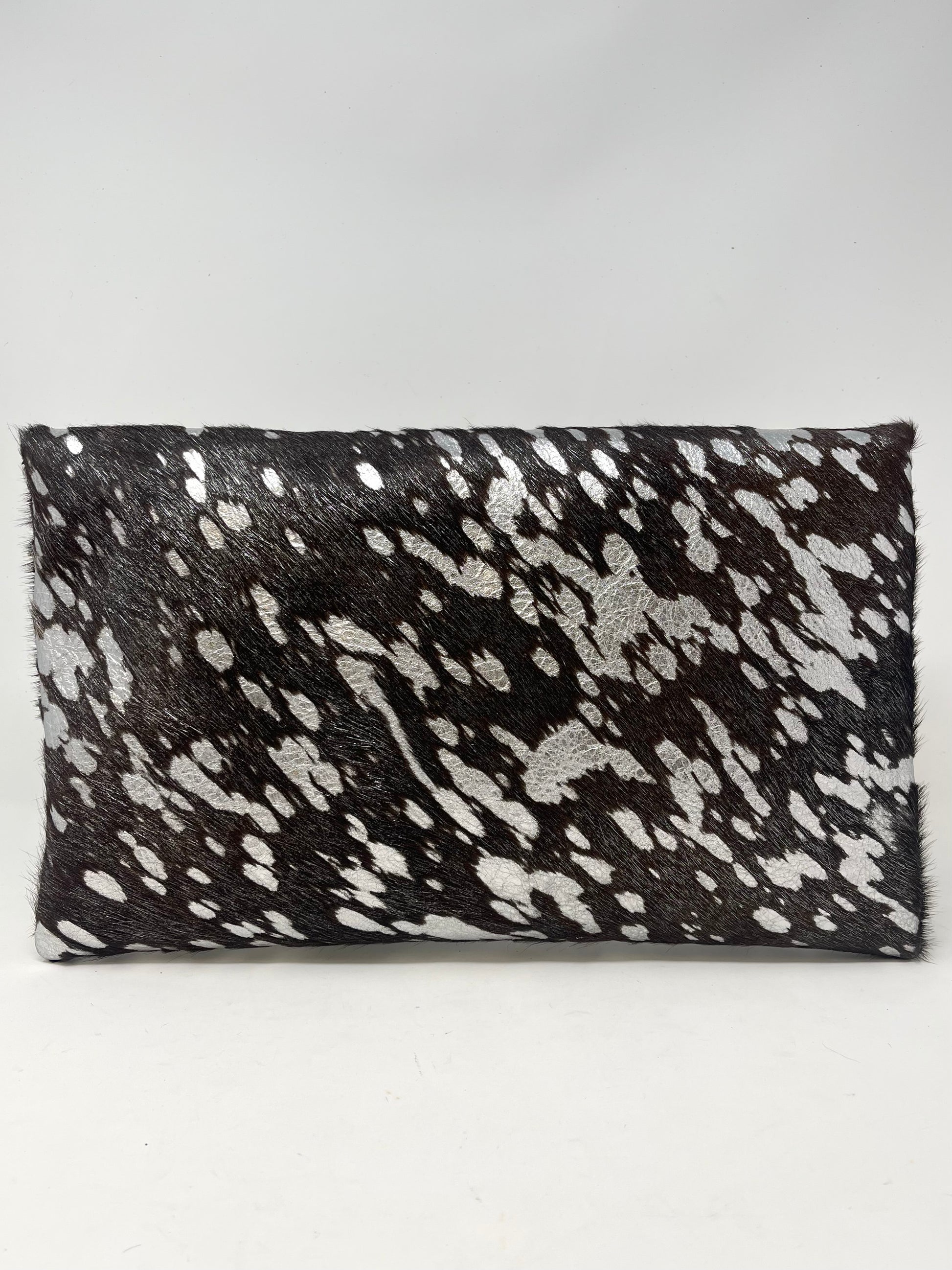 Black, brown, and white speckled clutch bag with silver accents