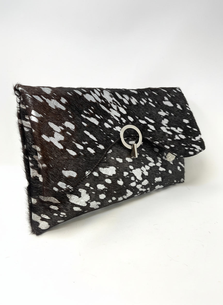 Black, brown, and white speckled clutch bag with silver accents
